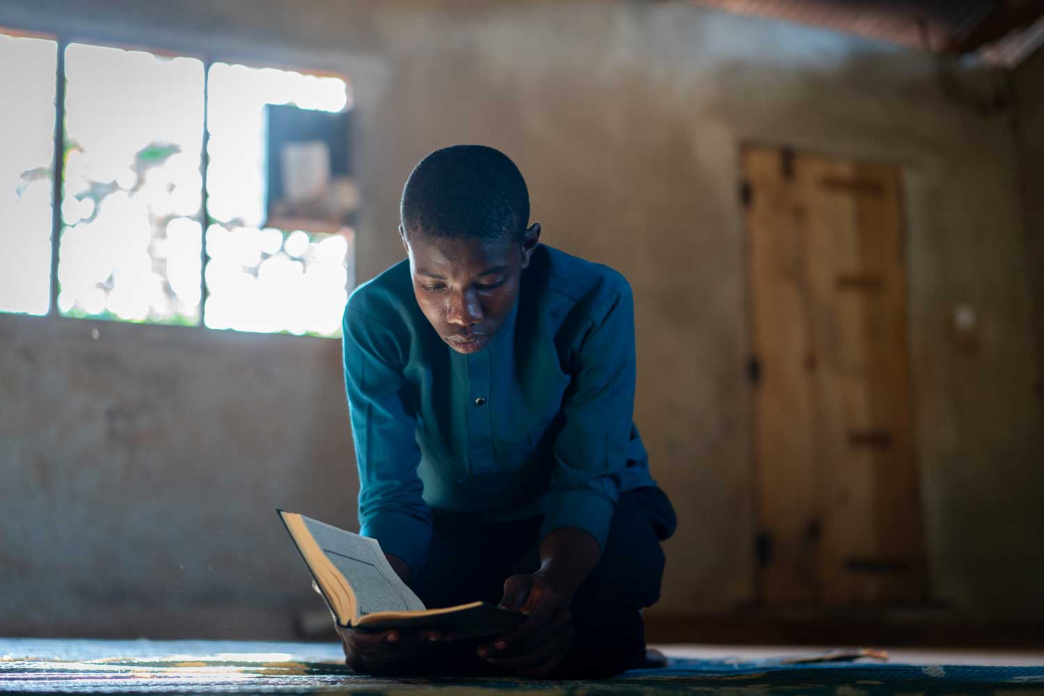 African Teenage Boy Sitting